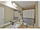 Updated bathroom featuring granite counters, tile floors, and neutral walls at 611 Robinson Oaks Ln, Plant City, FL 33567
