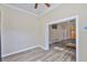 This bedroom boasts a ceiling fan, a TV, and an entrance to the Primary bathroom at 611 Robinson Oaks Ln, Plant City, FL 33567