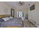 This bedroom features a queen sized bed, with an exterior pool view at 611 Robinson Oaks Ln, Plant City, FL 33567