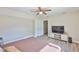 Spacious bedroom with laminate floors, large closet, and TV console at 611 Robinson Oaks Ln, Plant City, FL 33567