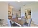 Open floor plan, dining room with view to bedroom and kitchen, neutral decor at 611 Robinson Oaks Ln, Plant City, FL 33567