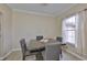 Dining area with large window for natural light and tile flooring at 611 Robinson Oaks Ln, Plant City, FL 33567