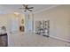 Inviting living room with tile flooring, neutral paint, and ample natural light creating a welcoming space at 611 Robinson Oaks Ln, Plant City, FL 33567