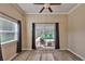 Bright living room with tile floors and a sliding glass door to the pool at 611 Robinson Oaks Ln, Plant City, FL 33567