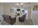 Cozy living room boasts a fireplace, TV, and plush brown reclining sofas at 611 Robinson Oaks Ln, Plant City, FL 33567
