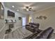 Inviting living room boasts a fireplace and comfortable brown reclining sofas at 611 Robinson Oaks Ln, Plant City, FL 33567