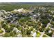 Aerial view of a neighborhood showcases tree coverage and proximity to water towers at 6489 30Th N St, St Petersburg, FL 33702