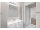 Bathroom featuring a vanity, mirror and access to the bedroom at 6489 30Th N St, St Petersburg, FL 33702