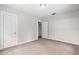 Bedroom featuring neutral paint, plush carpet and a view to another room at 6489 30Th N St, St Petersburg, FL 33702