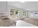 Kitchen with granite countertops, marble-look tile flooring, stainless sink, and windows for ample natural light at 6489 30Th N St, St Petersburg, FL 33702