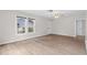 Bright living room with wood-look flooring and neutral walls, featuring plenty of natural light at 6489 30Th N St, St Petersburg, FL 33702