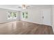 Bright, airy living room features hardwood floors, a ceiling fan, and ample natural light at 6489 30Th N St, St Petersburg, FL 33702