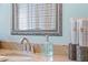 Bathroom with a granite countertop, a modern faucet, and decorative accents at 6611 Surfside Blvd, Apollo Beach, FL 33572
