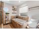 Bathroom showcasing a tiled soaking tub, open window, and glass-enclosed shower at 6611 Surfside Blvd, Apollo Beach, FL 33572