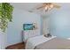Cozy bedroom featuring hardwood floors and calming light blue paint at 6611 Surfside Blvd, Apollo Beach, FL 33572
