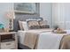 Bedroom showcasing stylish decor, side table, and natural light from the window at 6611 Surfside Blvd, Apollo Beach, FL 33572