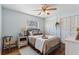 Comfortable bedroom with wood floors and closet doors at 6611 Surfside Blvd, Apollo Beach, FL 33572