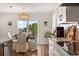 Cozy breakfast nook with a round table, white chairs, and a view of the water at 6611 Surfside Blvd, Apollo Beach, FL 33572
