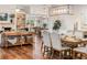 Bright dining room featuring hardwood floors and a dining table with seating for six at 6611 Surfside Blvd, Apollo Beach, FL 33572