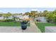Scenic view of a private dock with a boat in a waterfront community at 6611 Surfside Blvd, Apollo Beach, FL 33572