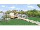 Picture of a private dock with a boat on a sunny day at 6611 Surfside Blvd, Apollo Beach, FL 33572