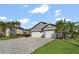 Lovely home with a paved driveway and a well maintained lawn at 6611 Surfside Blvd, Apollo Beach, FL 33572