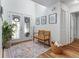 Bright foyer with glass paneled doors, a cozy wooden bench, and elegant decor, creating a welcoming entrance at 6611 Surfside Blvd, Apollo Beach, FL 33572