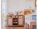 Charming beverage station and breakfast bar area features stylish white cabinets and seating at 6611 Surfside Blvd, Apollo Beach, FL 33572