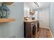 Convenient laundry room with modern washer and dryer, butcher block counters and stylish decor at 6611 Surfside Blvd, Apollo Beach, FL 33572
