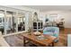 Inviting living room with hardwood floors, stylish furniture, and natural light from sliding glass doors at 6611 Surfside Blvd, Apollo Beach, FL 33572