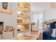 Cozy living area with fireplace, built-in shelving, and comfortable seating at 6611 Surfside Blvd, Apollo Beach, FL 33572