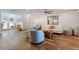 Open-concept living room showcasing wood floors, comfortable seating, and an abundance of natural light at 6611 Surfside Blvd, Apollo Beach, FL 33572