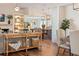 Open-concept living and dining area with wood floors, modern decor, and plenty of natural light at 6611 Surfside Blvd, Apollo Beach, FL 33572