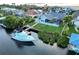 Aerial view of a waterfront home with a private dock and screened in lanai at 6611 Surfside Blvd, Apollo Beach, FL 33572