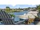 Scenic waterfront view featuring a private boat and serene canal homes at 6611 Surfside Blvd, Apollo Beach, FL 33572