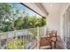 Outdoor balcony featuring chairs and privacy at 6627 Date Palm S Ave, St Petersburg, FL 33707