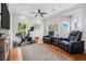Spacious bonus room with hardwood floors, lots of light, and cozy seating at 6627 Date Palm S Ave, St Petersburg, FL 33707