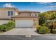 Charming home with a two-car garage featuring manicured landscaping including flowering bushes at 6627 Date Palm S Ave, St Petersburg, FL 33707