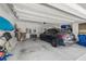Spacious two-car garage with a SUV, storage and surf boards at 6627 Date Palm S Ave, St Petersburg, FL 33707