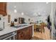 Spacious kitchen featuring modern appliances with an open layout into the Gathering room and dining area at 6627 Date Palm S Ave, St Petersburg, FL 33707