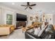 Bright and airy living room with modern decor, open to the dining area and kitchen with great flow at 6627 Date Palm S Ave, St Petersburg, FL 33707