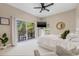 Bright main bedroom with a sliding glass door to a private balcony and neutral decor at 6627 Date Palm S Ave, St Petersburg, FL 33707