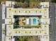 Bird's eye view of a charming condominium complex with a refreshing pool and well-maintained landscaping at 701 Poinsettia Rd # 340, Belleair, FL 33756