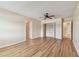 Spacious bedroom featuring laminate flooring, closet, and access to other rooms at 701 Poinsettia Rd # 340, Belleair, FL 33756