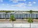 Spacious condominium complex boasting lush palm trees and ample parking for residents and guests at 701 Poinsettia Rd # 340, Belleair, FL 33756