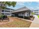 Charming condominium clubhouse with outdoor seating, lush landscaping, and easy access for residents at 701 Poinsettia Rd # 340, Belleair, FL 33756