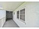 Exterior hallway featuring windows and secure access points at 701 Poinsettia Rd # 340, Belleair, FL 33756