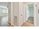 Neutral hallway with views into the living area and closet space at 701 Poinsettia Rd # 340, Belleair, FL 33756