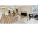 Inviting living space with wood floors, dining area, and kitchen access at 701 Poinsettia Rd # 340, Belleair, FL 33756