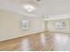 Large living space filled with natural light and featuring wood flooring at 701 Poinsettia Rd # 340, Belleair, FL 33756
